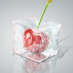 Ice Cube with cherry inside. Ice effect created with 3D Photoshop Tools